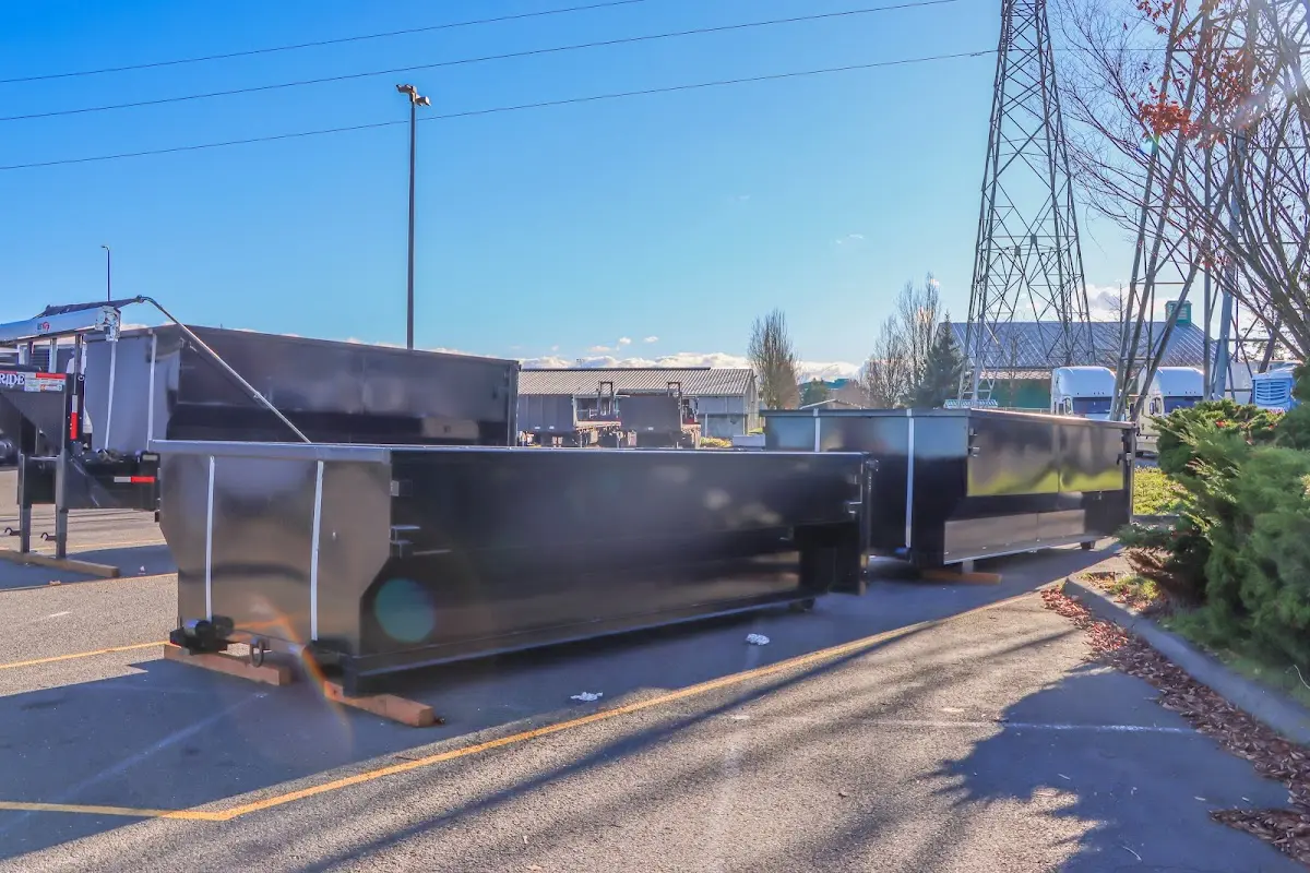 Roll-off dumpster ready for waste disposal at job site for Roofing Dumpster Rental in Clarksdale